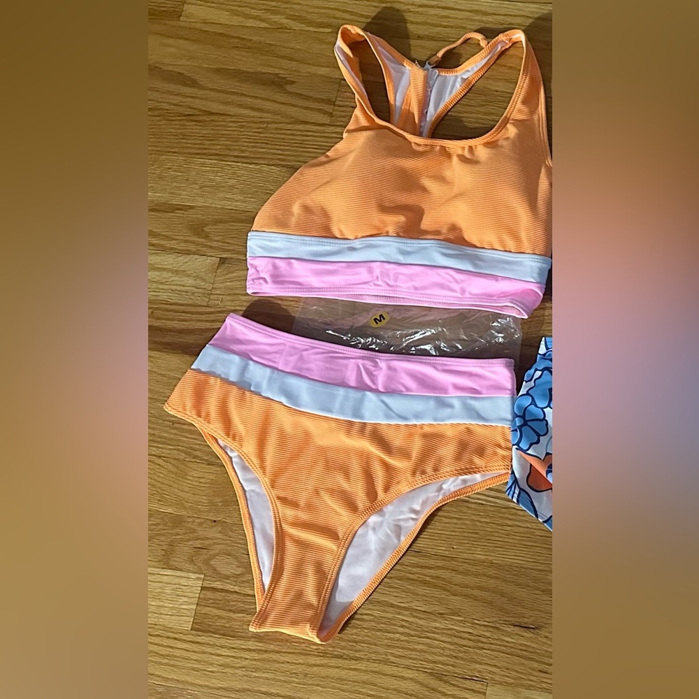 Brand new swimsuit. Never worn. Medium.